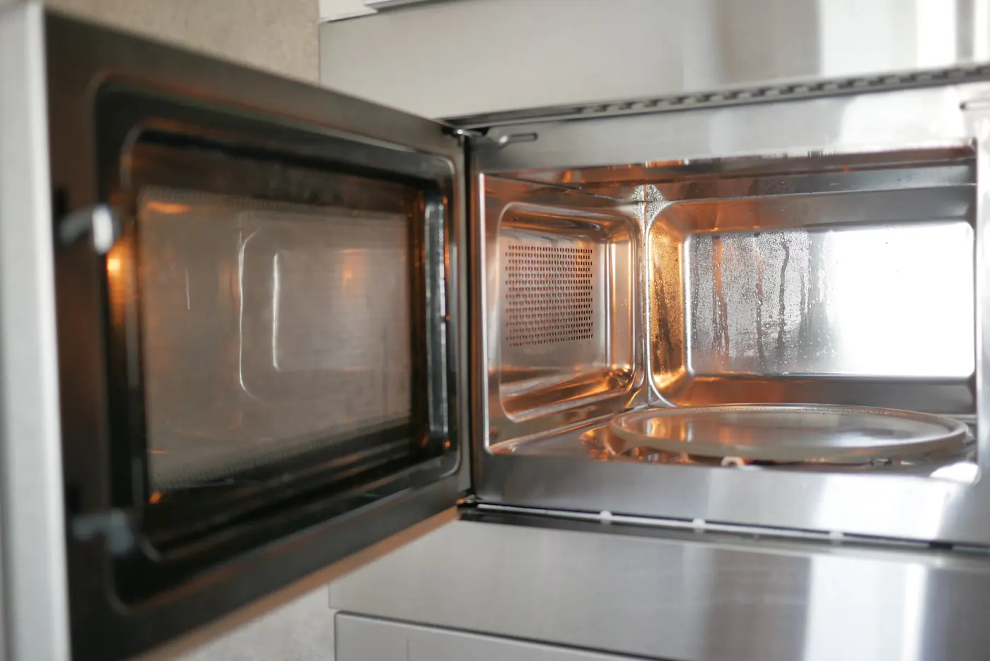 Inside of a microwave oven with the door open